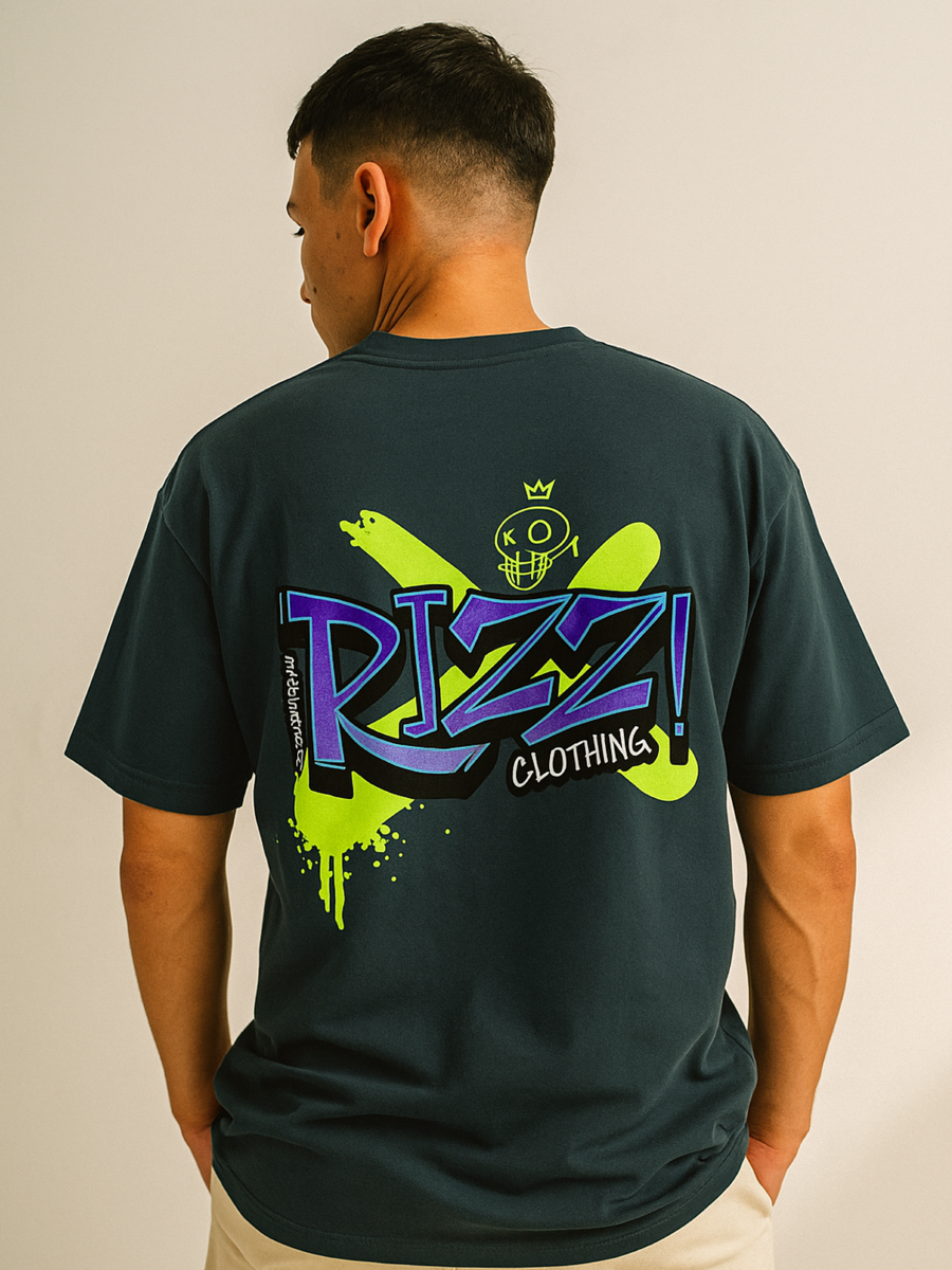 Person wearing a bottle green t-shirt with colorful graphics and text on the back, against a plain background.
